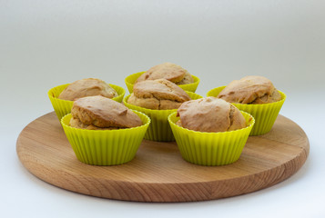 Banana muffins on a wooden board, natural light