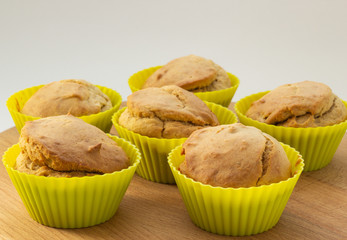 Banana muffins on a wooden board, natural light, close-up