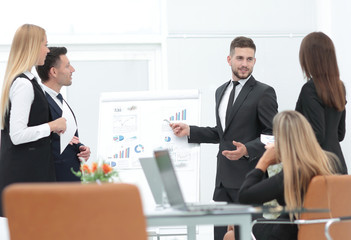 businessman makes a presentation to his business team