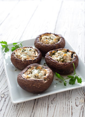Mushrooms stuffed with cheese and greens
