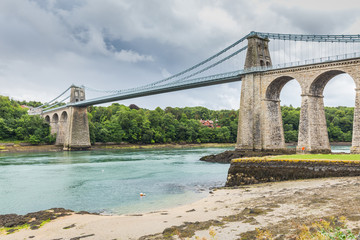 Menai Suspension Bridge between Anglesey and mainland of North Wales, UK. The bridge, opened in 1826, is known as the first modern suspension bridge in the world.