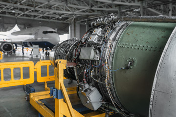 Jet airplane turbine on repairing in hangar