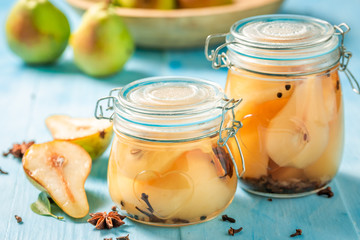 Natural and juicy pickled pears in the jar