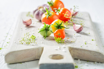 Fresh ingredients for pickled red tomatoes in summer