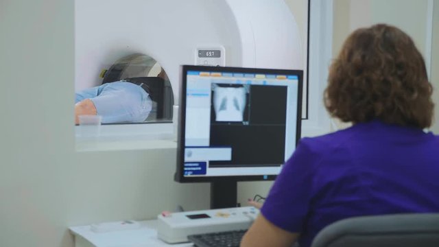 Elderly patient is scanned by MRI, CT scanner at modern hospital.