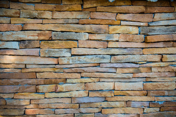 Fototapeta premium the stone wall texture background natural color.Background of stone wall texture photo.Natural stone wall texture for background.Old Brick texture, Grunge brick wall background.