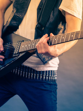 Man playing on electric guitar