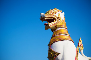 Naklejka premium Lion sculpture in Asia temple. Asia culture art. Endemic culture art of Asia. image for objects and copy space.