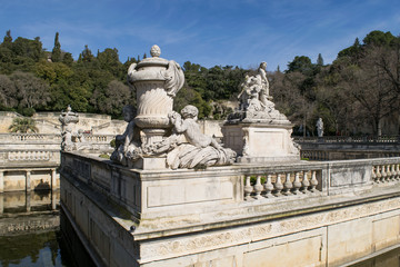 Fototapeta na wymiar Marble sculptures in the gardens of Jardins de la Fontaine in Nimes, France