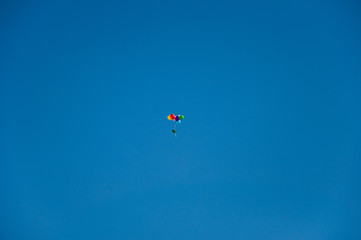Background colorful balloons flying in the blue sky