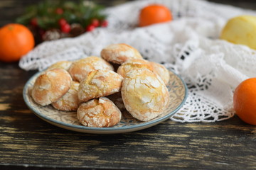 Lemon cookies with cracks with sugar powder on a plate