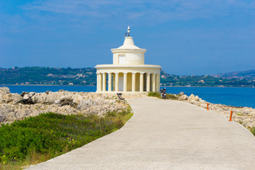 Fototapeta na wymiar Lighthouse of saint theodore in Argostoli Kefalonia, Greece. One of the main attractions and landmarks located on the coastal road from Argostoli to Lassi. 