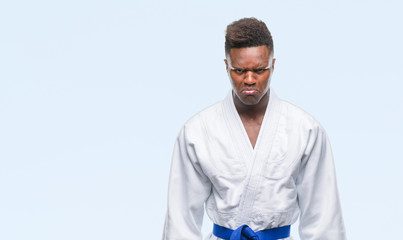 Young african american man over isolated background wearing kimono depressed and worry for distress, crying angry and afraid. Sad expression.