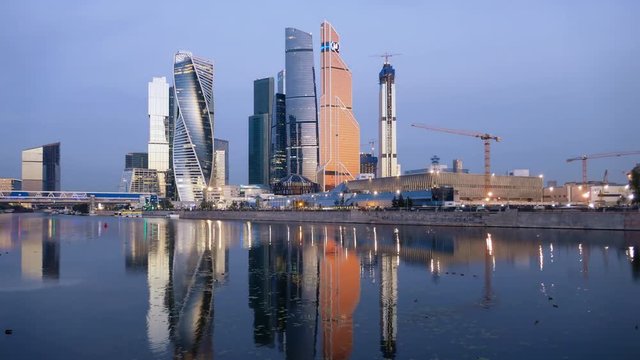Morning time lapse of Moscow City (Moscow International Business Center) and calm Moskva river, Russia.