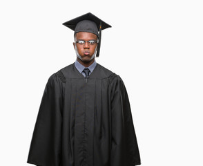 Young graduated african american man over isolated background puffing cheeks with funny face. Mouth inflated with air, crazy expression.