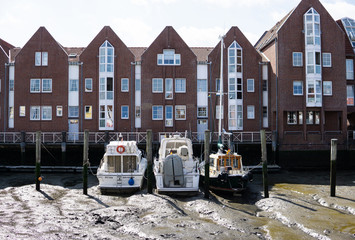 Three boats on low tide