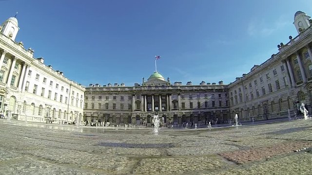 Footage view of spurting water fountains by Somerset House in London, UK on a sunny day. Ultra wide angle view. 