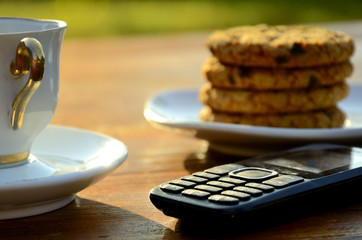 Oatmeal cookies with coffee on a summer morning.