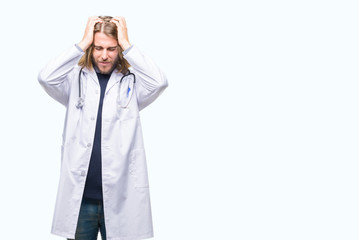 Young handsome doctor man with long hair over isolated background suffering from headache desperate and stressed because pain and migraine. Hands on head.