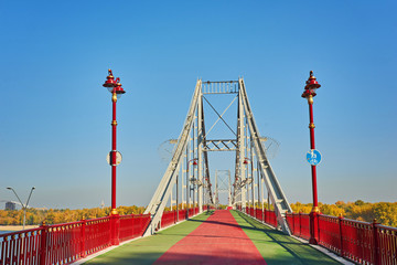 Naklejka premium Pedestrian bridge across the Dnieper River, autumn landscape, Kiev