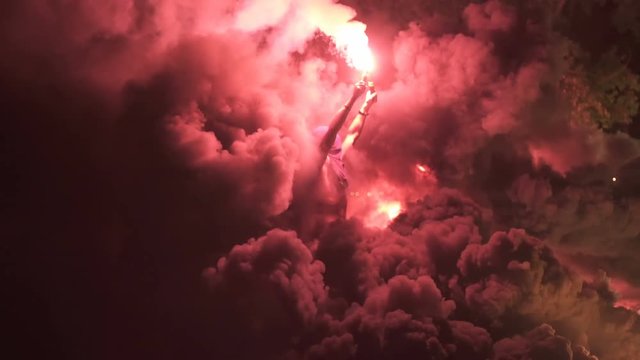 Football Fan with Fire Torch and Smoke