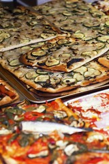 Cooking. Pizza slices with fried vegetables mushrooms.