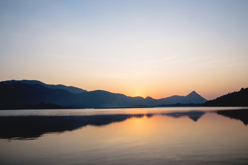 Reflect of the mountain in the lake at national park Kanchanaburi, Thailand. Amazing nature landscape. image for background, wallpaper, copy space, decoration and arts.