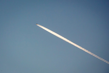condensation light line in the sky from aircraft. the line on  sky look like plane crash comet and...