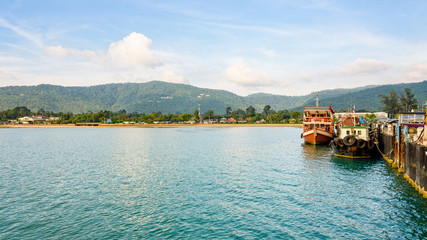 Wooden boat for dive tour docked at Nathon Pier near Nathon Beach with a peaceful sea atmosphere in the evening at Koh Samui island, Surat Thani province, Thailand, 16:9 widescreen