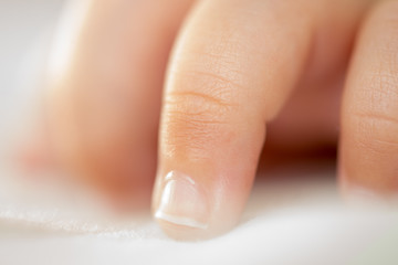 close up macro baby small tily finger care tender concept medicine
