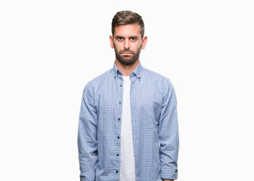 Young handsome man wearing white t-shirt over isolated background depressed and worry for distress, crying angry and afraid. Sad expression.