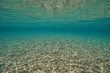 Underwater sand below water surface in the Mediterranean sea, natural scene, Spain