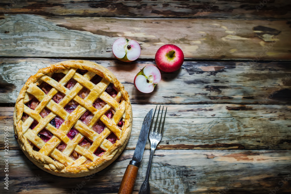 Wall mural homemade fruit pie on wooden table.