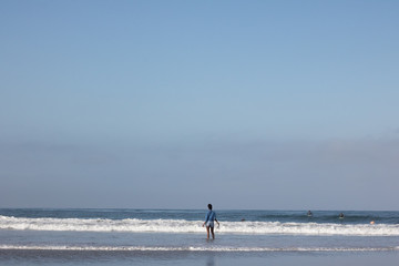 Ethnic Woman Walking into the Sea