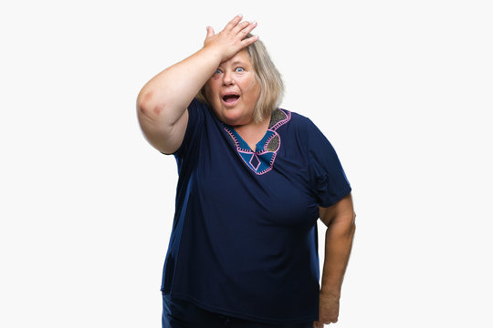 Senior plus size caucasian woman over isolated background surprised with hand on head for mistake, remember error. Forgot, bad memory concept.