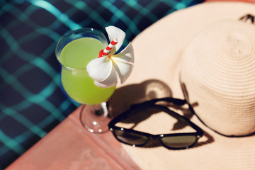 Fresh guava juice smoothie drink with straw hat , flower and sunglasses