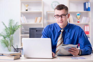 Young employee preparing for vacation trip 