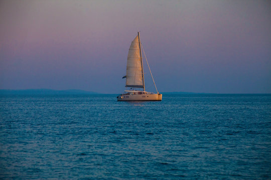 Catamaran yacht at sunset