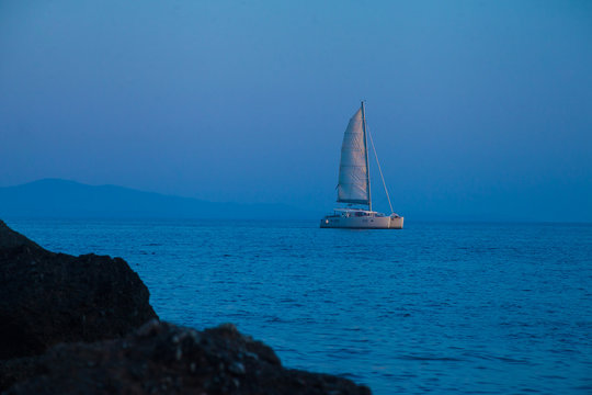 Catamaran at sea during blue hour