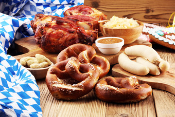 Traditional German cuisine, Schweinshaxe roasted ham hock. Beer, pretzels and various Bavarian specialties. Oktoberfest background