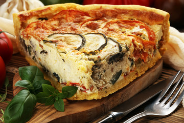 Homemade Cheesy Egg Quiche for Brunch with Spinach and Tomato, onions and zucchini.