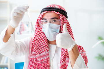 Arab chemist checking the quality of drinking water