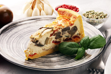 Homemade Cheesy Egg Quiche for Brunch with Spinach and Tomato, onions and zucchini.