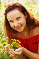 young woman and wild flowers. 