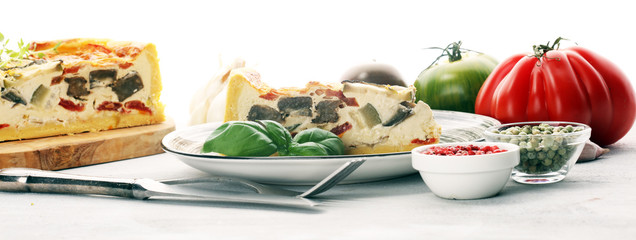 Homemade Cheesy Egg Quiche for Brunch with Spinach and Tomato, onions and zucchini.