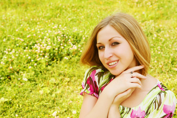 young woman relaxing in the grass 