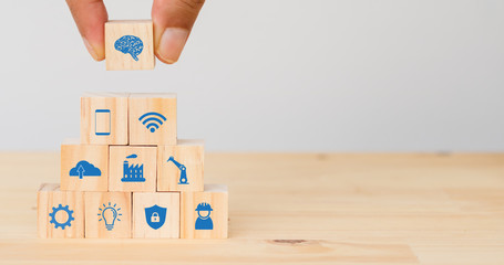 smart factory, industry 4.0 futuristic technology trend concept, Hand man put the icon to connect, icons including wifi, ai ,artificial intelligence, phone, cloud computer, robot, engineer, power