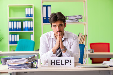 Sick and unhappy businessman sitting in the office 