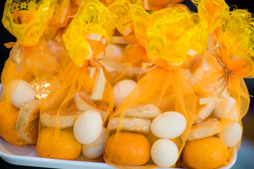 Close-up the wedding gift, was wrapped with luxury mesh cloth for guest wedding ceremony. image for objects, copy space and illustration.