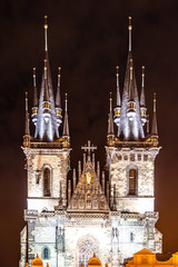 Fototapeta na wymiar Two gothic towers of Church Of Our Lady Before Tyn at Old Town Square by night. Prague, Czech Republic.